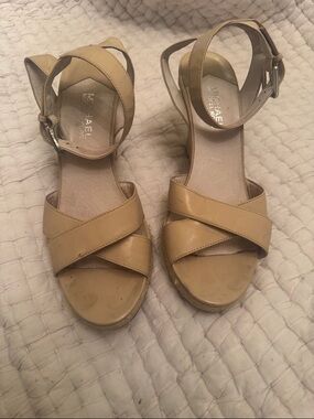Michael Kors Neutral Tan Crisscross Wedge Sandals with a secure ankle strap